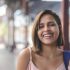 Portrait of smiling young woman looking at camera